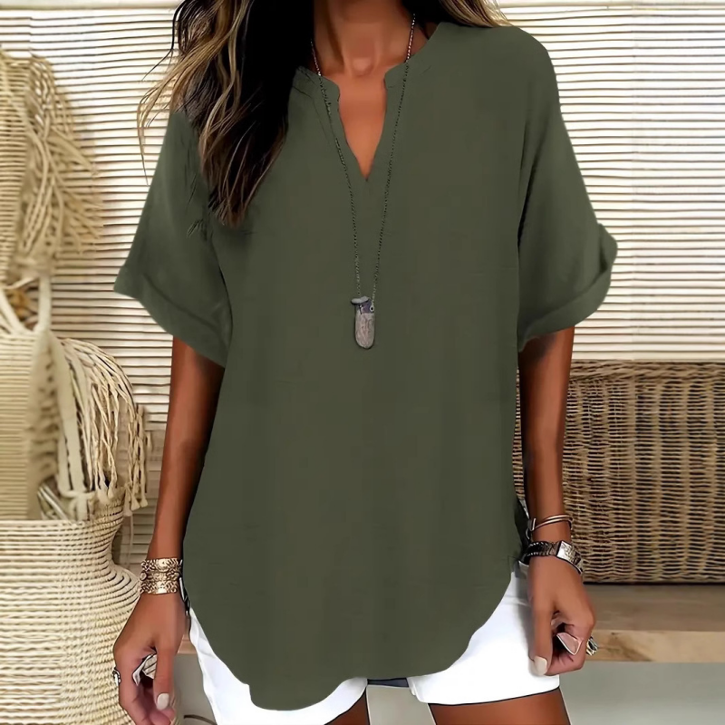 Blusa elegante y holgada con cuello abierto