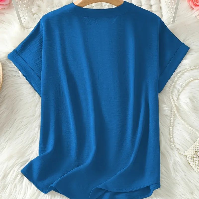 Blusa elegante y holgada con cuello abierto