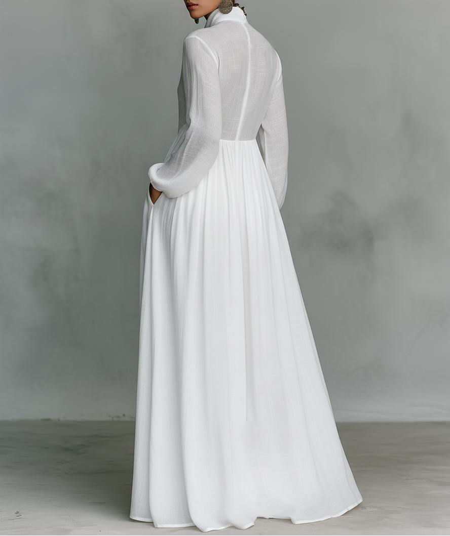 Maxi minimalista de algodón y lino con patchwork, cuello alto y mangas largas