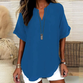 Blusa elegante y holgada con cuello abierto