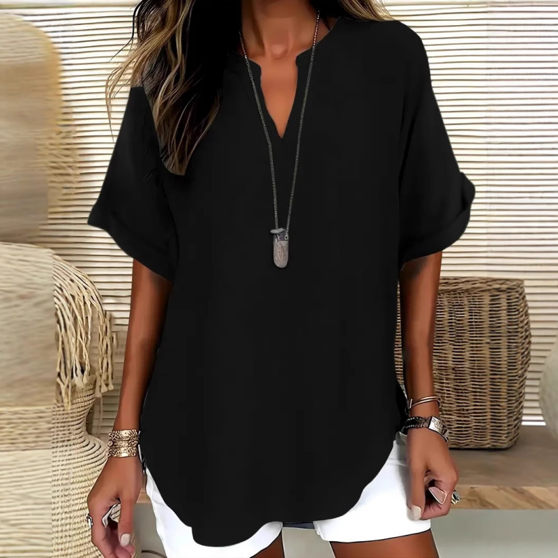 Blusa elegante y holgada con cuello abierto