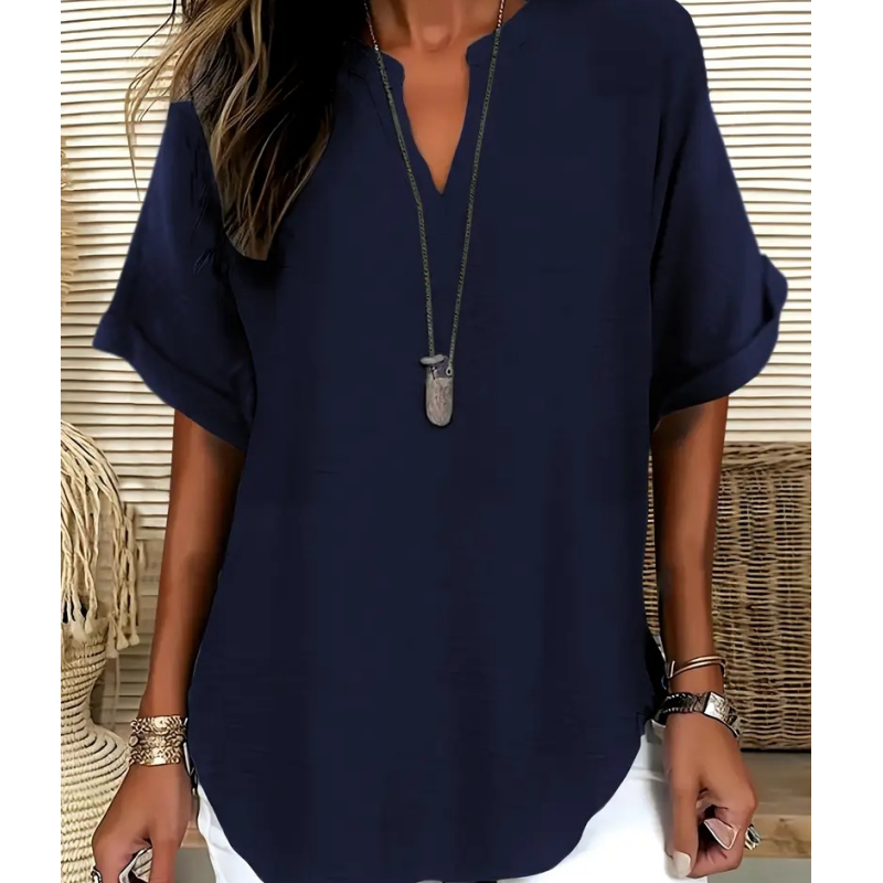 Blusa elegante y holgada con cuello abierto